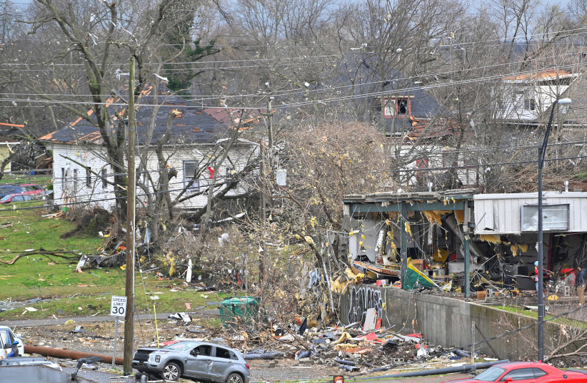 Damage to buildings and vehicles is seen after a tornado hit eastern Nashville (photo credit: HARRISON MCCLARY / REUTERS)