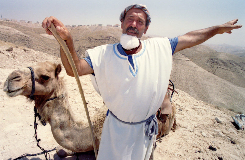 THE BOOK gives new takes on Genesis. Pictured: A guide in ancient Hebrew dress in 1994 describes biblical settlement in the Judean Desert at the Land of Genesis tourist attraction. (photo credit: REUTERS)