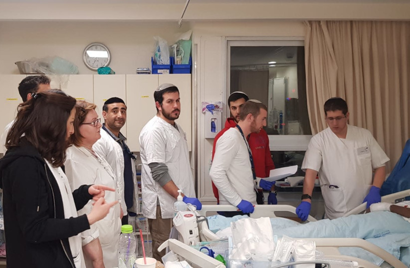 JCT MALE Nursing Program students take part in clinical training at Shaare Zedek (photo credit: BARAK ZALKSHVILI)