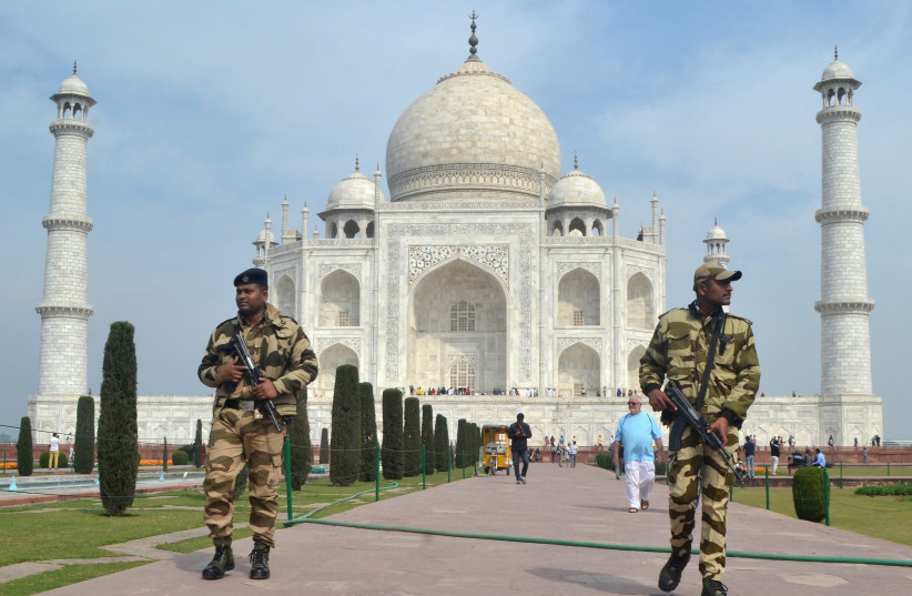 Central Industrial Security Force (CISF) personnel patrol at the historic Taj Mahal premises, where U.S. President Donald Trump and first lady Melania Trump are expected to visit, in Agra, India, February 20, 2020 (photo credit: REUTERS/STRINGER)