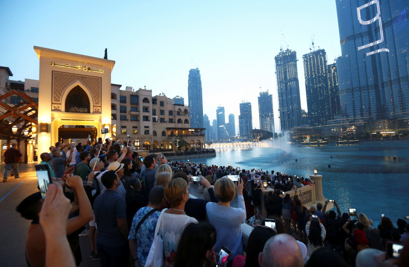 PEOPLE WATCH the fountains in Dubai in the United Arab Emirates. (photo credit: REUTERS)