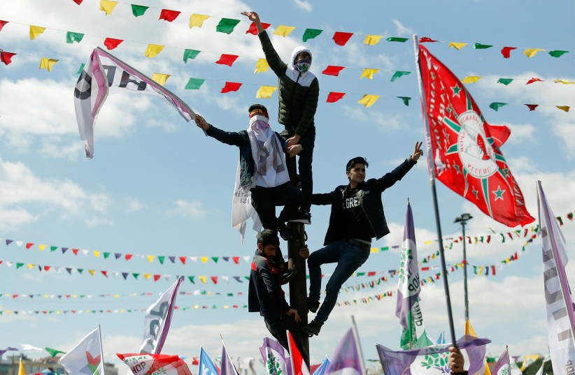 People gather to celebrate Newroz, which marks the arrival of spring and the new year, in Istanbul (photo credit: REUTERS)