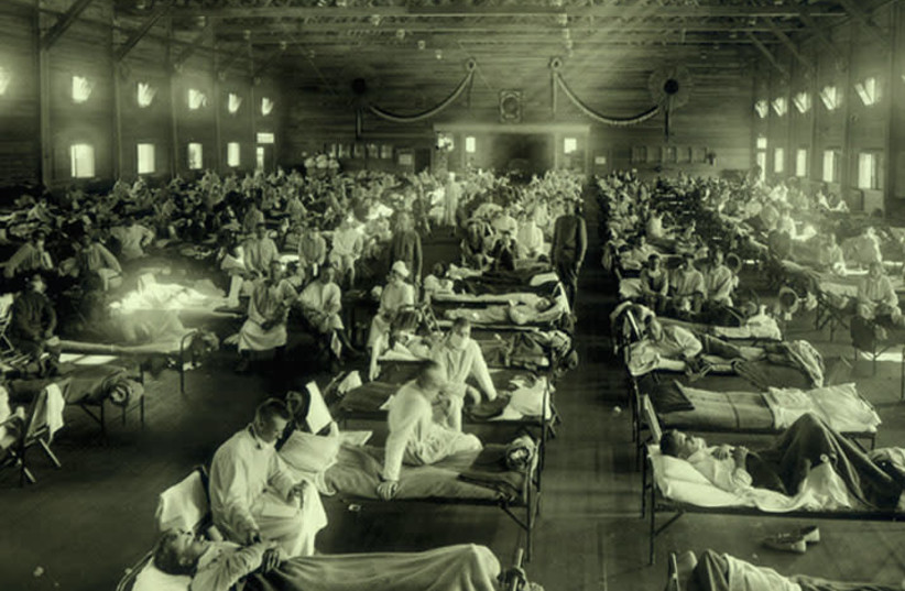 People are seen being treated for the Spanish Flu. (photo credit: COURTESY OF THE OTIS HISTORICAL ARCHIVES)