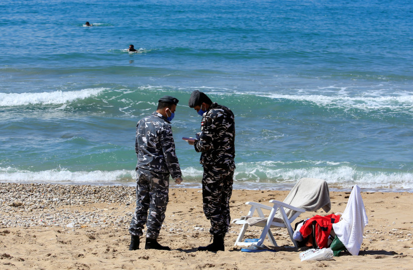 LEBANESE POLICE write people a ticket for using the beach. (photo credit: REUTERS)