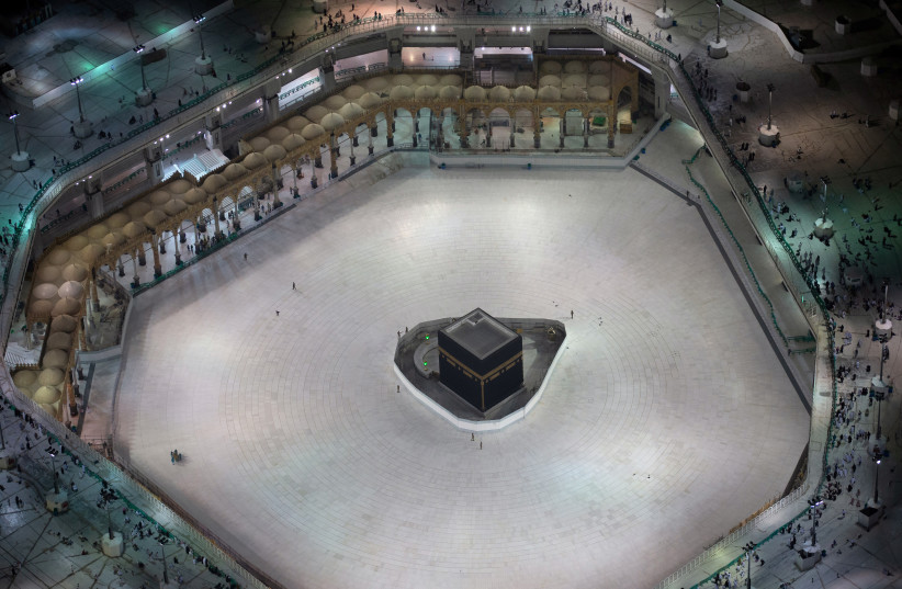 General view of Kaaba at the Grand Mosque, which is almost empty of worshippers, after Saudi authority suspended umrah amid the fear of coronavirus outbreak, at Muslim holy city of Mecca (photo credit: YASSER BAKHSH/ REUTERS)