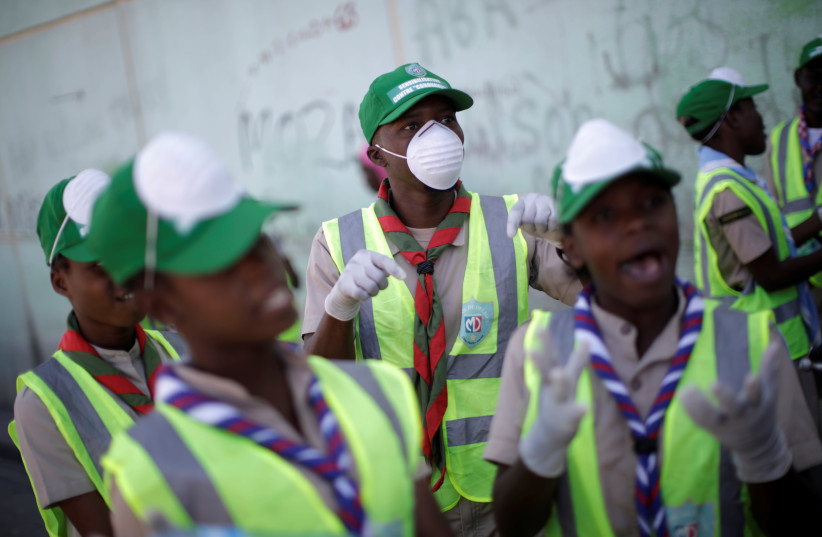 Haitian Scouts take part in COVID-19 prevention campaign in Port-au-Prince (photo credit: REUTERS)