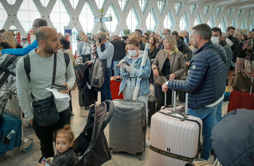 PASSENGERS WAIT for their flights at Marrakesh Airport earlier this month. Several special flights departed Morocco, taking thousands of stranded Europeans home as the kingdom announced it was suspending all regular air traffic due to the coronavirus. (photo credit: AFP/GETTY IMAGES/TNS)