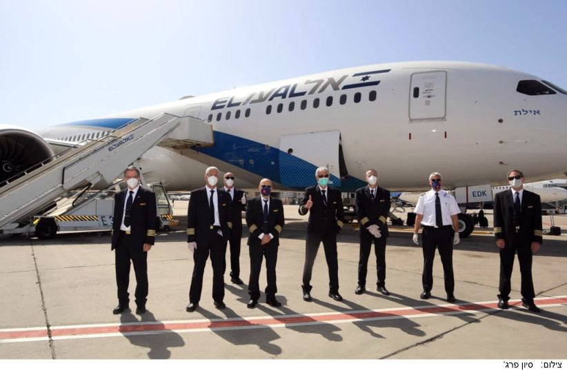 The El Al flight staff that manned the longest flight in Israeli aviation history, returning stranded Israeli back Australia and New Zealand on April 3 2020 (photo credit: SIVAN FARAG)