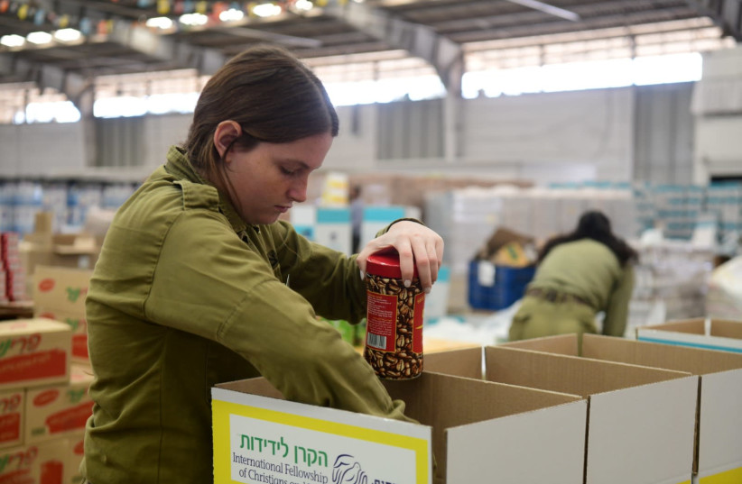 The Fellowship is committing to help an additional 15,000 elderly aged 75 and above with packages of food, hand sanitizer, and other essential items (photo credit: YOSSI ZELIGER)