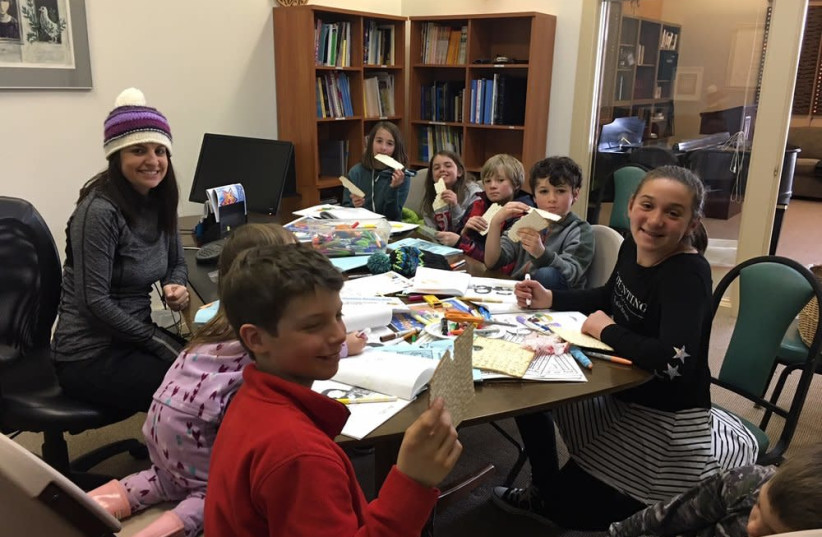Setting the stage for Passover with matzah at the Wood River Jewish Community's Hebrew school (photo credit: COURTESY OF THE WOOD RIVER JEWISH COMMUNITY)