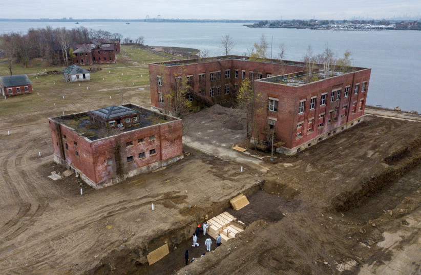 Drone pictures show bodies being buried on New York's Hart Island amid the coronavirus disease (COVID-19) outbreak in New York City (photo credit: LUCAS JACKSON/REUTERS)