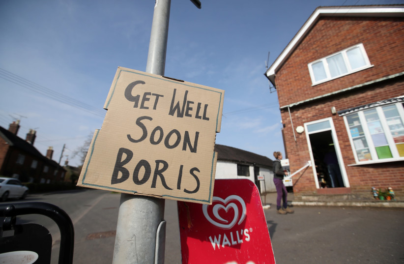 A sign of support for British Prime Minister Boris Johnson, who has been in hospital since Monday as the spread of the coronavirus disease (COVID-19) continues, in Swynnerton, Britain, April 9, 2020 (photo credit: REUTERS/CARL RECINE)