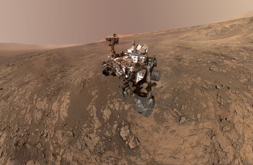 NASA's Curiosity Mars Rover snaps a self-portrait at a site called Vera Rubin Ridge on the Martian surface (photo credit: REUTERS)