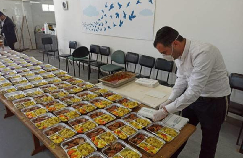 Mana Hama soup kitchen preparing meals for delivery during the coronavirus pandemic (photo credit: IFCJ)
