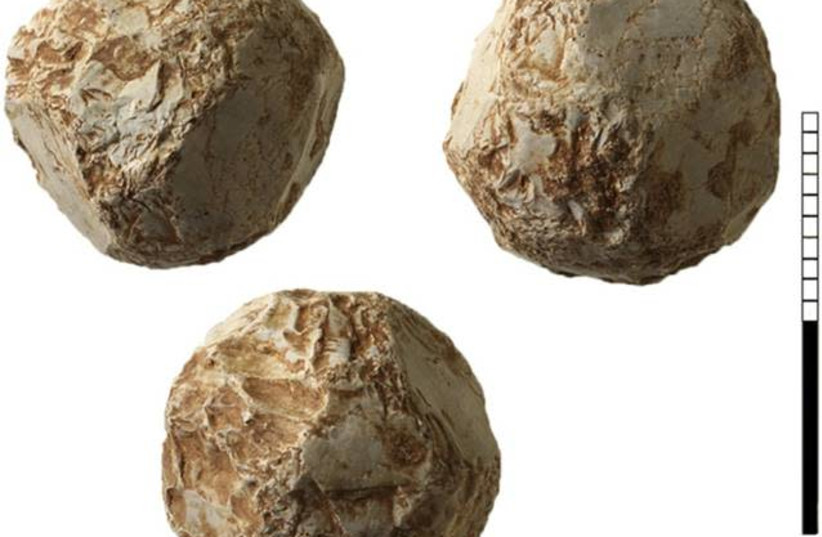 Shaped stone ball from Qesem Cave (photo credit: PAVEL SHRAGO)