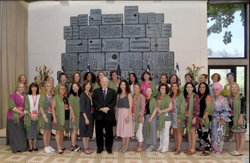  LORI PALATNIK stands at President Reuven Rivlin’s right at the President’s Residence along with mothers of lone soldiers in July 2019.  (photo credit: GPO)