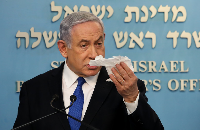 Prime Minister Benjamin Netanyahu at one of his nightly statements about the coronavirus COVID-19 in March (photo credit: FLASH90)