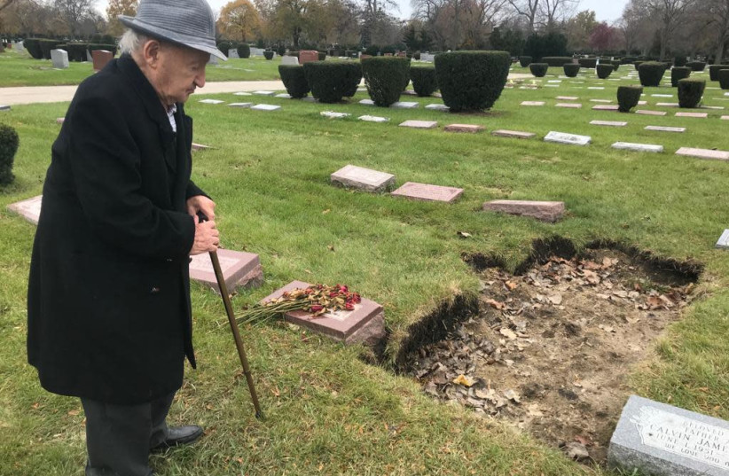 Holocaust survivor Michael Okunieff visiting his wife's grave in Chicago before making aliyah in November 2019 (photo credit: DAVID PERSIKO)