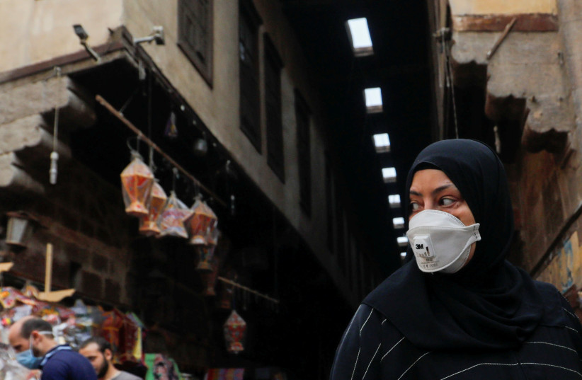 The spread of the coronavirus disease (COVID-19), ahead of the Muslim holy month of Ramadan in Cairo, Egypt (photo credit: AMR ABDALLAH DALSH / REUTERS)