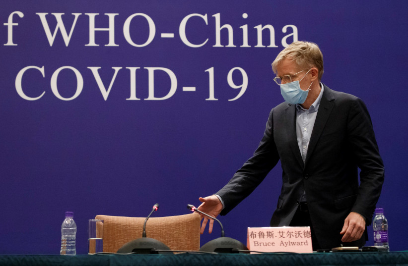 Bruce Aylward of the World Health Organisation (WHO) attends a news conference of the WHO-China Joint Mission on Covid-19 about its investigation of the coronavirus outbreak in Beijing, China, February 24, 2020. (photo credit: REUTERS/THOMAS PETER)