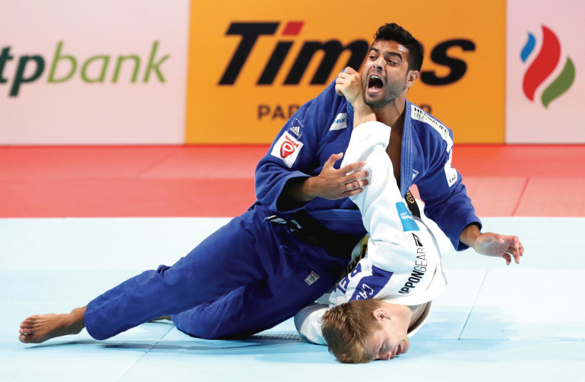 ISRAEL JUDOKA Sagi Muki (top) – one of the blue-and-white’s top medal contender at the Olympics – has been training by himself over the past month, but can’t wait to return to the mat in some capacity as soon as possible. (photo credit: REUTERS)