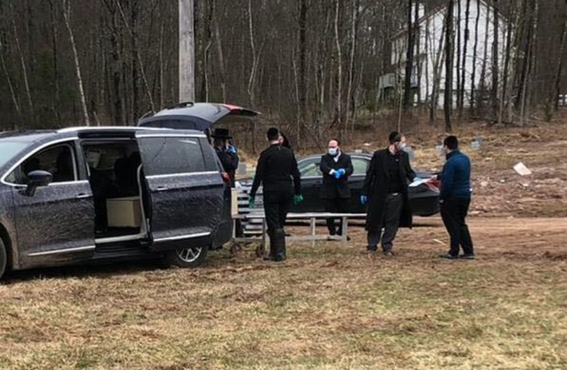 Members of Chesed Shel Emes, a burial society based in Brooklyn, transport a body for burial at the cemetery it operates in Woodridge, N.Y. (photo credit: COURTESY OF RABBI MAYER BERGER)