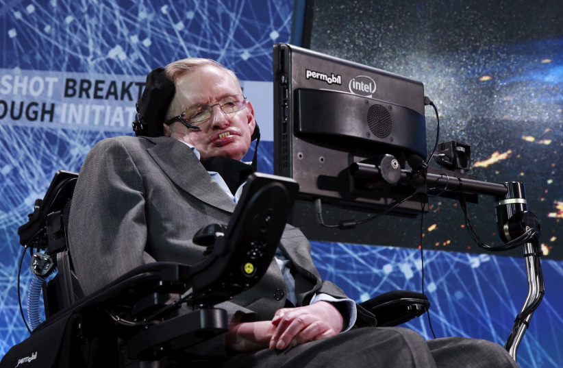 Physicist Stephen Hawking sits on stage during an announcement of the Breakthrough Starshot initiative with investor Yuri Milner in New York April 12, 2016.  (photo credit: LUCAS JACKSON/REUTERS)