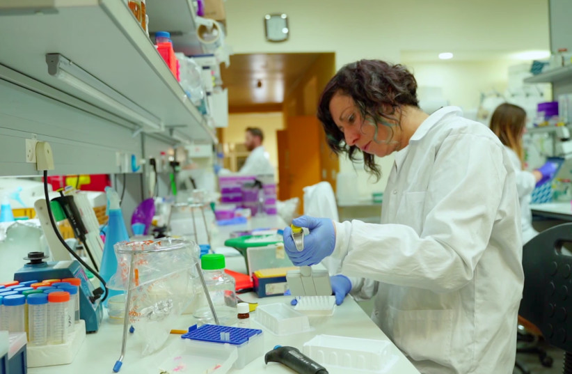 A MigVax researcher works on a COVID-19 vaccine. (photo credit: COURTESY MIGVAX AND OURCROWD)