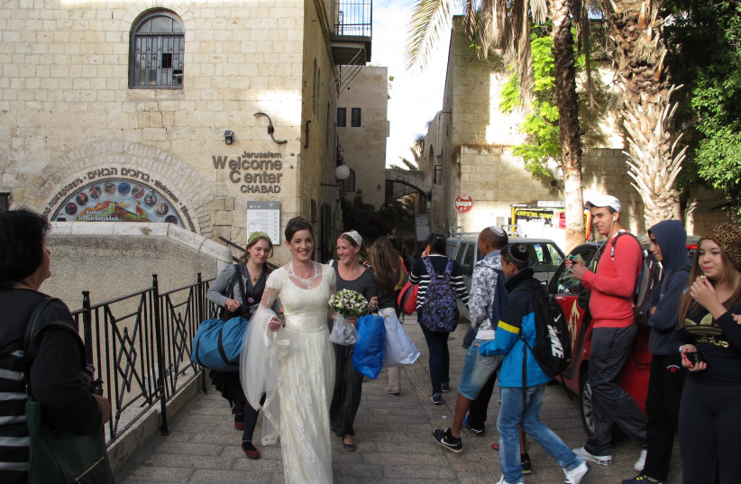 WEDDING DAY: Talia walks from her childhood home in the Jewish Quarter.  (photo credit: COURTESY ABRAMOWITZ FAMILY PHOTO COLLECTION)