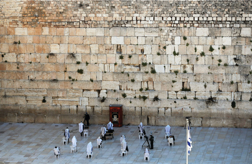 Limited priestly blessing takes place during Passover at the Western Wall, Jerusalem, April 12, 2020 (photo credit: REUTERS)