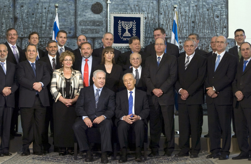 The 2009 Likud-led government, with 30 ministers.  (photo credit: MENAHEM KAHANA / REUTERS)