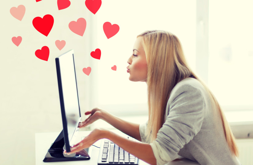 Virtual relationships, online dating and social networking concept - woman sending kisses with computer monitor (credit: INGIMAGE)