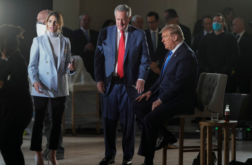 President Donald Trump consults with counselor to the president Hope Hicks and White House Chief of Staff Mark Meadows, May 3, 2020 (photo credit: JOSHUA ROBERTS / REUTERS)