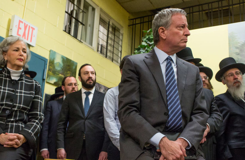 New York City Mayor Bill de Blasio attends a news conference with Satmar Jewish community leaders in the aftermath of the deadly hate attack on a kosher market in Jersey City, N.J., Dec. 12, 2019.  (photo credit: ANDREW LICHTENSTEIN/CORBIS VIA GETTY IMAGES)
