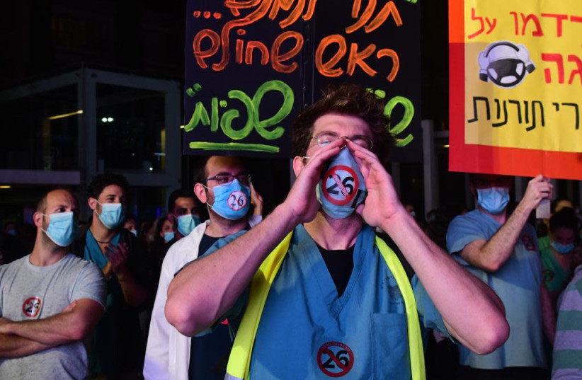 Medical interns protest at Tel Aviv's Habima Square on Saturday, May 9.  (credit: MAARIV)