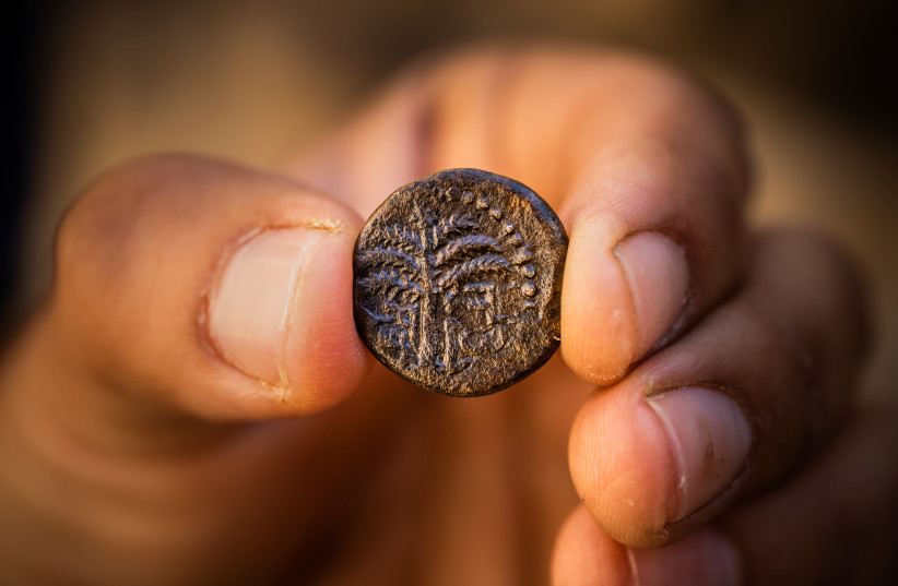 Bar Kokhba Revolt Coin inscribed with the word "Jerusalem" and a picture of a date palm (photo credit: KOBI HARATI/CITY OF DAVID)