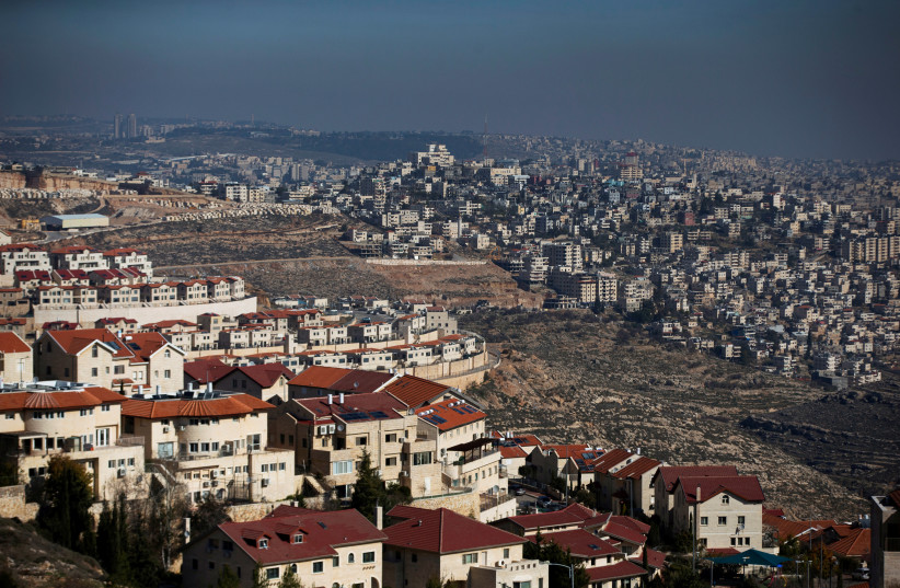 A general view picture shows the Israeli settlement of Efrat (L) in the Gush Etzion settlement block as Bethlehem is seen in the background, January 28, 2020 (photo credit: RONEN ZVULUN/REUTERS)