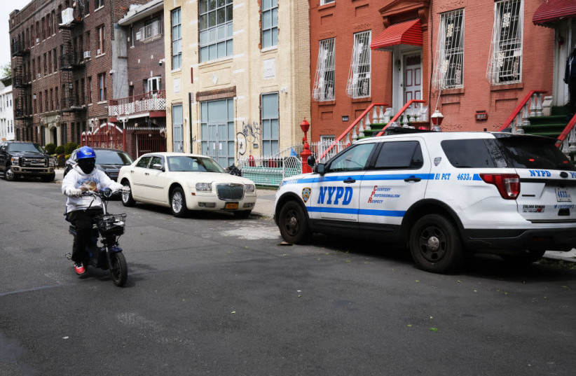 Police keep watch at the Nitra Yeshiva on May 19, 2020 in Brooklyn, NY. Police broke up a session of about 60 students at the Orthodox yeshiva. (photo credit: SPENCER PLATT/GETTY IMAGES/JTA)