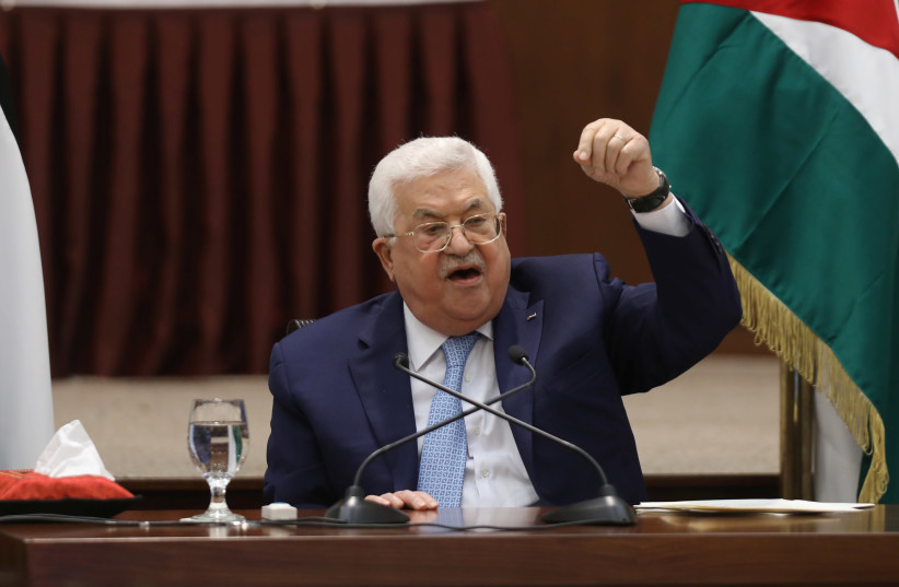 Palestinian President Mahmoud Abbas speaks during a leadership meeting in Ramallah, in the West Bank May 19, 2020 (credit: ALAA BADARNEH/POOL VIA REUTERS)