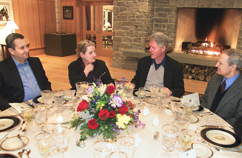 THEN-PRIME MINISTER Ehud Barak (left) attends a dinner hosted by US president Bill Clinton (second from right), with US Secretary of State Madeleine Albright (second from left) and Syrian foreign minister Farouq al-Shara, during talks at Shepherdstown, West Virginia, in January 2000 (photo credit: REUTERS)