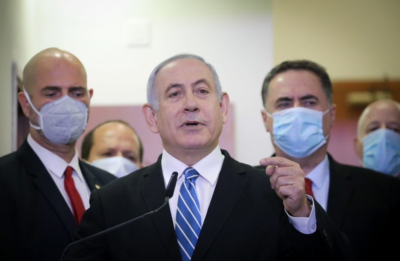 Prime Minister Benjamin Netanyahu speaks outside of court ahead of the start of his trial, May 24, 2020 (photo credit: YONATAN SINDEL/FLASH90)