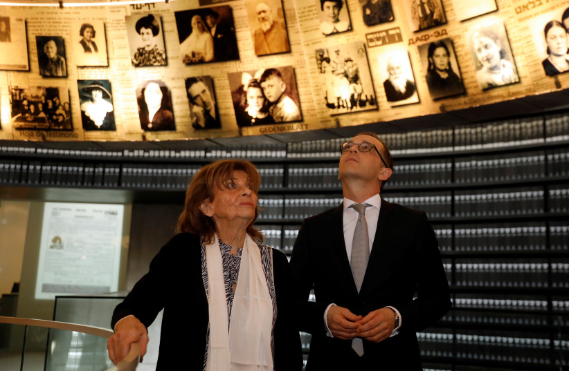 German Foreign Minister Heiko Maas, accompanied by Holocaust survivor Charlotte Knobloch, visit the Hall of Names in Yad Vashem Holocaust History Museum in Jerusalem, March 25, 2018 (photo credit: REUTERS/Ronen Zvulun)