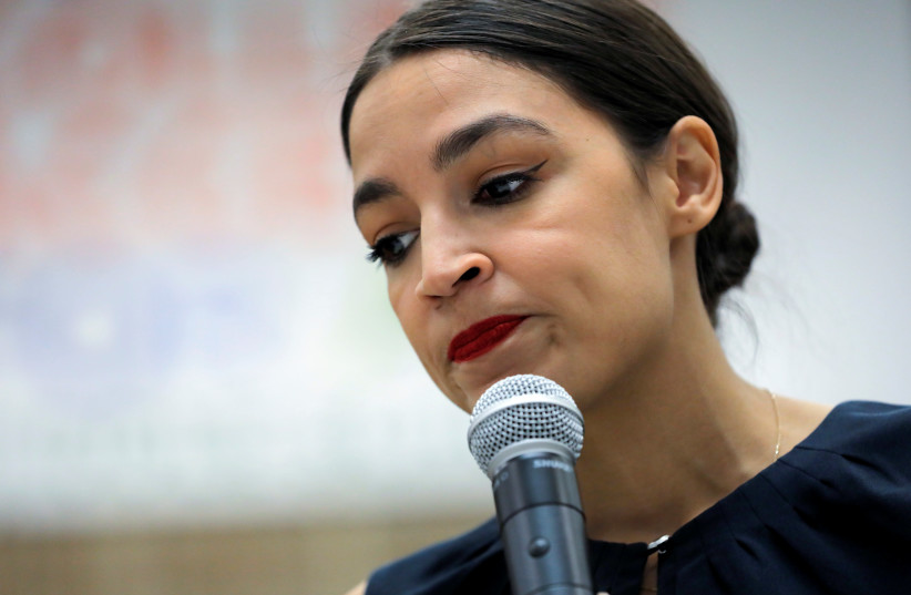 U.S. Rep. Alexandria Ocasio-Cortez (D-NY) speaks to media before participating in a Census Town Hall at the Louis Armstrong Middle School in Queens, New York City (photo credit: REUTERS)