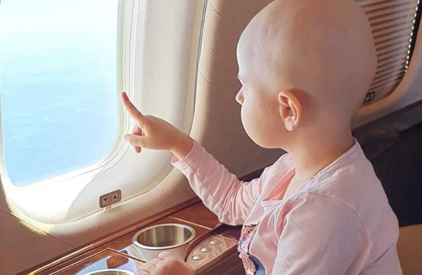 Four-year old Sabin while on a private flight to receive innovative cancer treatment in New York. (Photo credit: Israel Kasem)