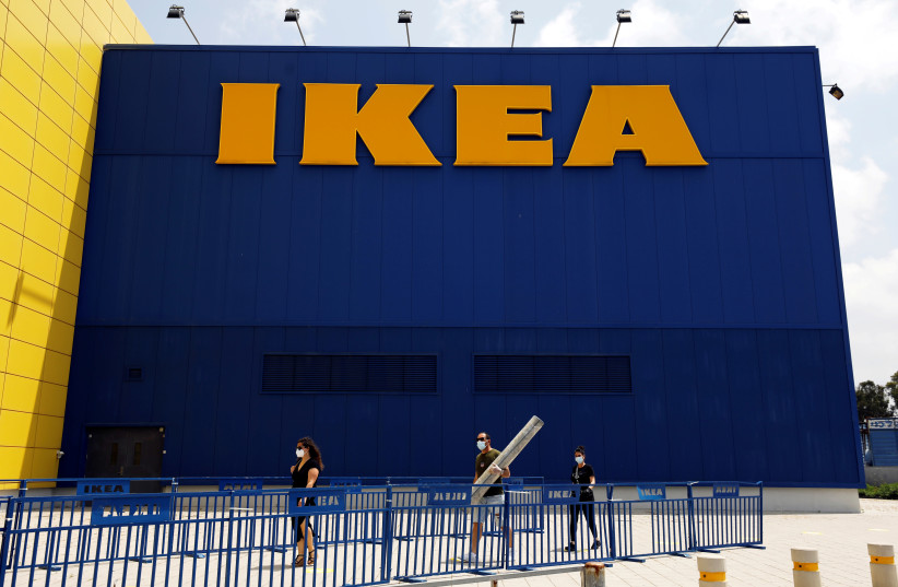 Customers wait outside an IKEA shop after the coronavirus disease (COVID-19) lockdown has been eased around the country and the company opens some of its stores, in Netanya, Israel April 23, 2020. (credit: REUTERS/AMIR COHEN)