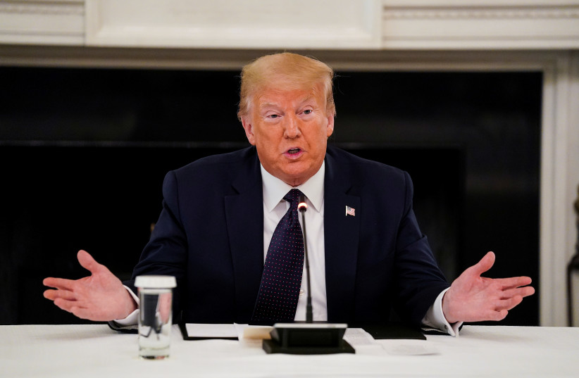 US President Donald Trump speaks during a roundtable discussion with law enforcement in the State Dining Room at the White House in Washington, US, June 8, 2020 (photo credit: REUTERS/KEVIN LAMARQUE)