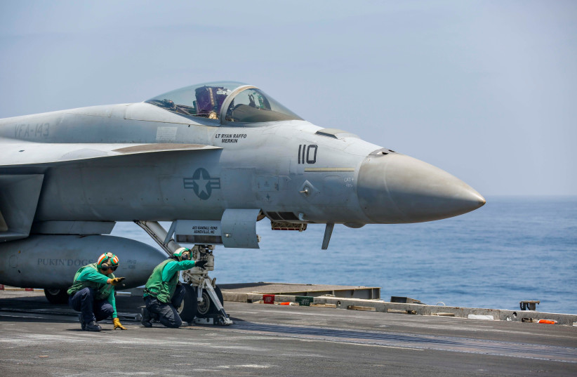 An F/A-18E Super Hornet attached of Strike Fighter Squadron (VFA) 143 hooks up to a catapult on the flight deck of U.S. Navy's aircraft carrier USS Abraham Lincoln in the Gulf, in this picture taken August 27, 2019 and released by U.S. Navy on August 27, 2019 (photo credit: MICHAEL SINGLEY/US NAVY/HANDOUT VIA REUTERS)