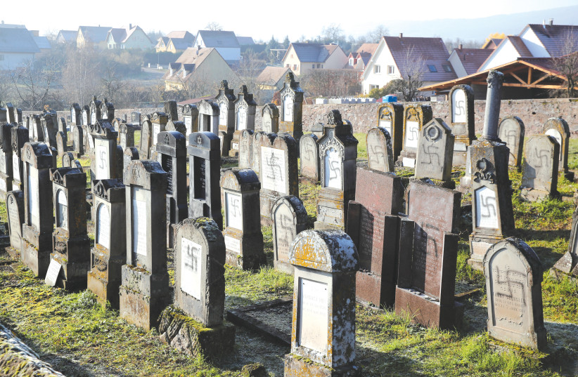 SWASTIKAS ON a graveyard in France. (photo credit: REUTERS)