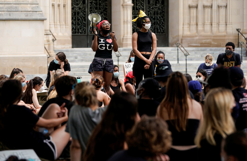 Demonstrators hold a Black Lives Matter sit-in to protest the death in Minneapolis police custody of George Floyd, outside the National Cathedral in Washington, D.C.,U.S., June 5, 2020 (photo credit: REUTERS/JOSHUA ROBERTS)