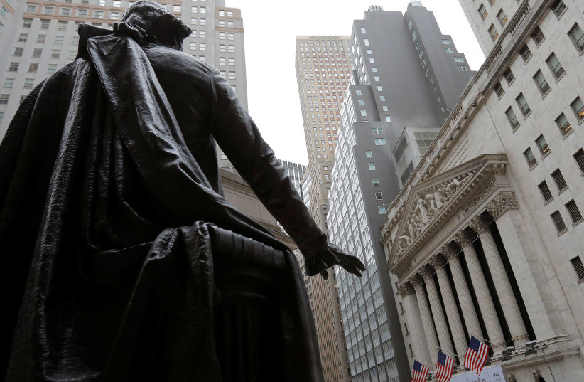 A statue of George Washington is seen outside the New York Stock Exchange (NYSE) (photo credit: REUTERS)